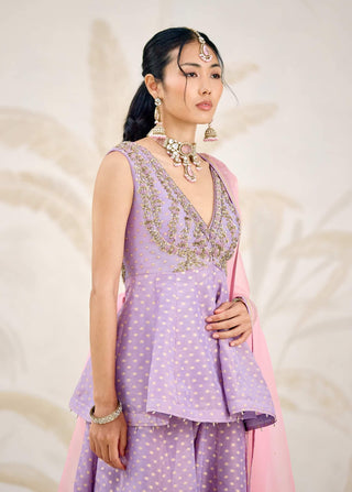 Front detail of embroidered neckline and sleeve construction