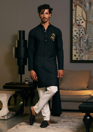 Black Asymmetric Drape Kurta by Siddartha Tytler Men, available on Indiaspopup.com