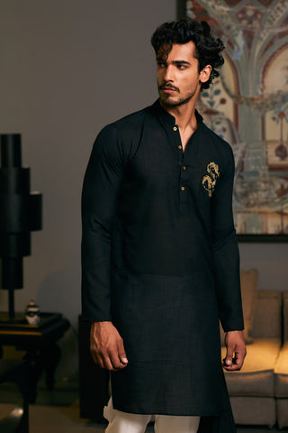 Black Asymmetric Drape Kurta by Siddartha Tytler Men, available on Indiaspopup.com