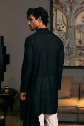 Black Asymmetric Drape Kurta by Siddartha Tytler Men, available on Indiaspopup.com