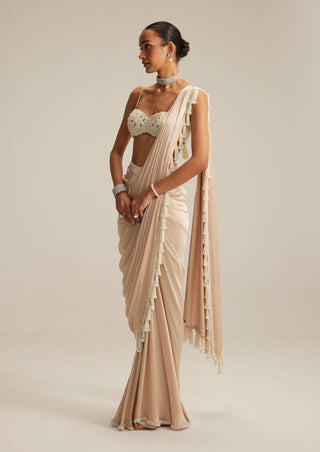 Light beige draped sari and blouse
