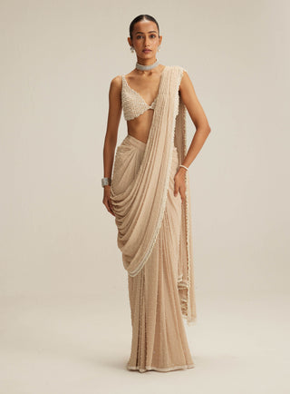 Light beige draped sari and blouse