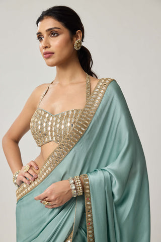 Powder blue satin sari and halter blouse