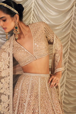 Champagne Sukhan Lehenga Set by Ridhi Mehra, available on Indiaspopup.com