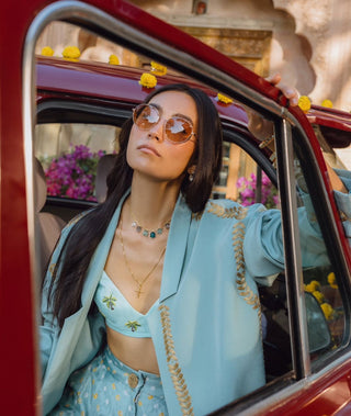 Blue bralette, bandhani trousers and jacket